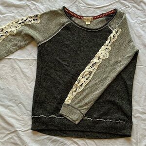 Very cute sweater with cream fabric lace sleeves